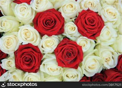 Red and white roses in a bridal floral arrangement