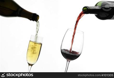 red and white wine being poured