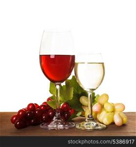 Red and white wine in glass over wooden table