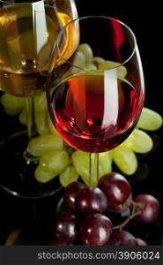 Red and white wine in glasses with grape. Top view