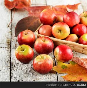 Red And Yellow Apples On A Wooden Surface