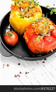 Red and yellow bell stuffed peppers with rice and minced meat. Stuffed pepper with meat