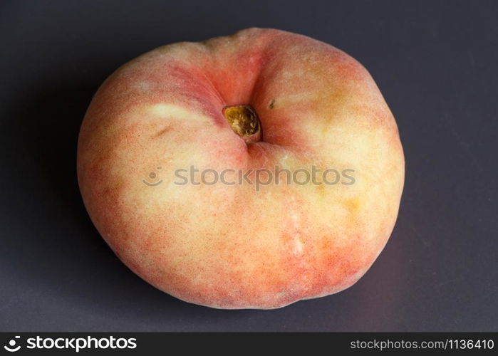 Red and yellow vine peach on gray background