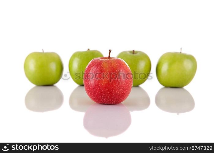 Red apple among green apples isolated on a white background
