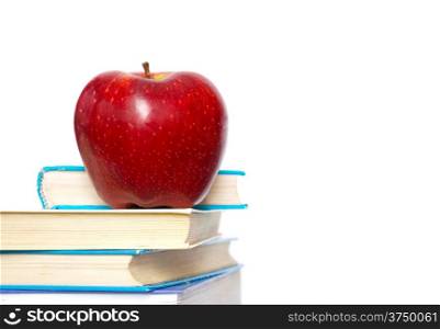 Red apple and stack of books for school