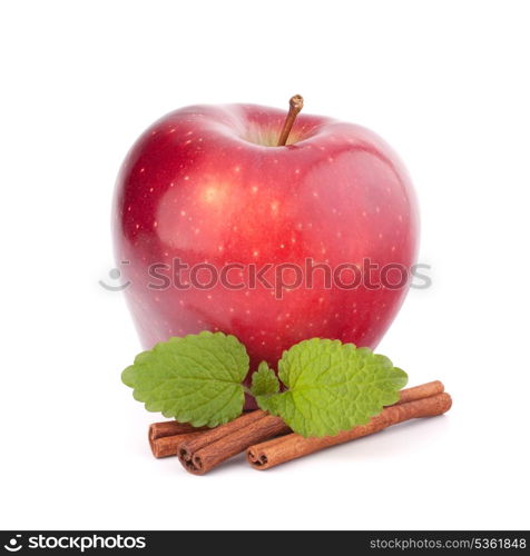 Red apple, cinnamon sticks and mint leaves still life isolated on white cutout.