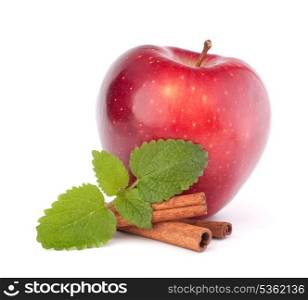 Red apple, cinnamon sticks and mint leaves still life isolated on white cutout.