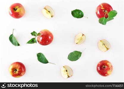 Red apple fruits on white background. Pattern with apples flat lay. Top view.