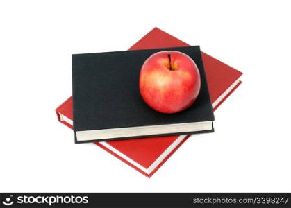 red apple on a book isolated on white