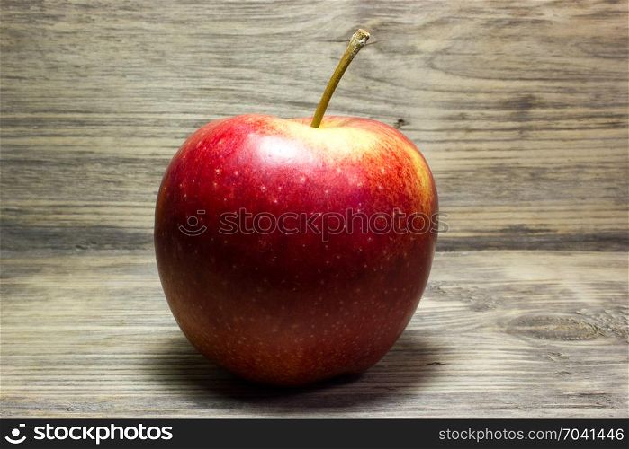 Red Apple on wooden background