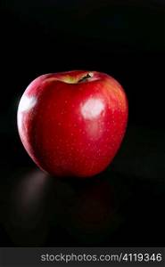 red apple over black background