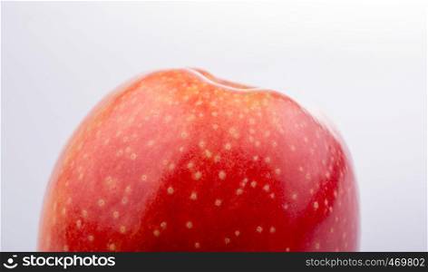 Red apple with dots in close up view