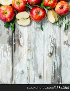 Red apples and Apple slices. On a white wooden background.. Red apples and Apple slices.