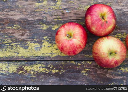 red apples background on rustic wood