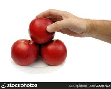 Red apples on a white plate on a white background, isolated