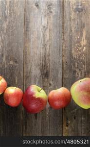 red apples on wooden background