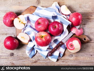 red apples on wooden board