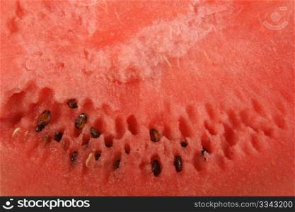 Red background of ripe watermelon. Close-up.