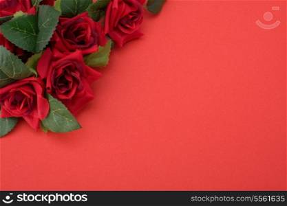 Red background with floral decor. Flowers are artificial.