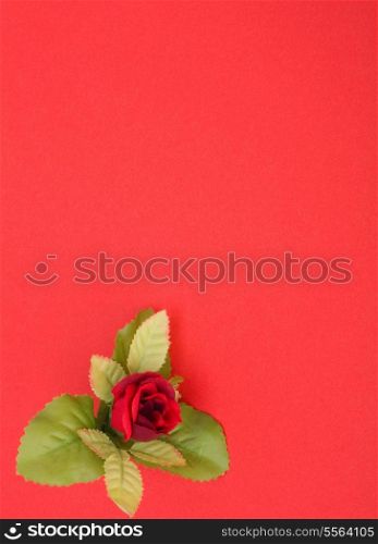 Red background with floral decor. Flowers are artificial.