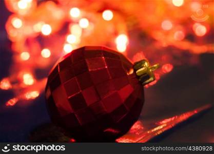 red ball against xmas lights