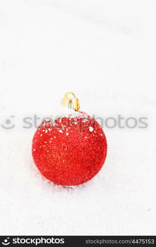 Red Ball with snow for the Xmas tree decoration