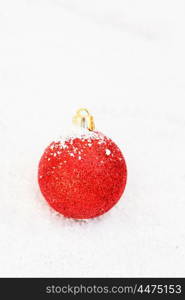 Red Ball with snow for the Xmas tree decoration