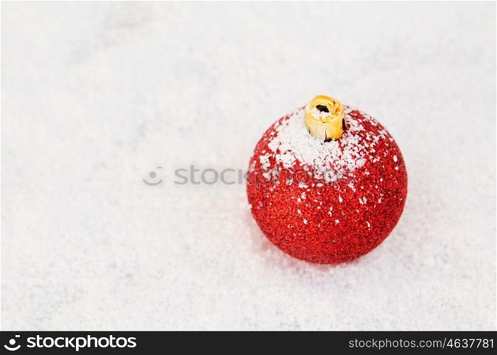 Red Ball with snow for the Xmas tree decoration