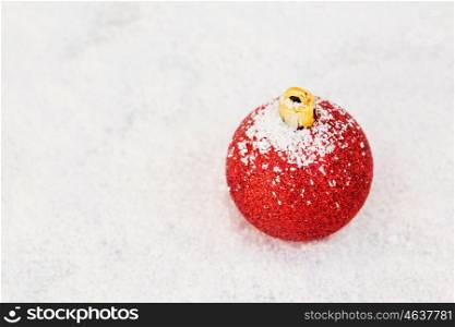 Red Ball with snow for the Xmas tree decoration