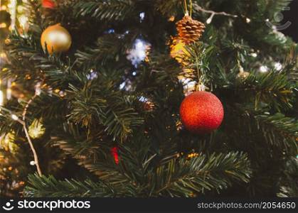 Red balls decorated with Christmas tree decorations. New year and Christmas festivals. Copy space background.