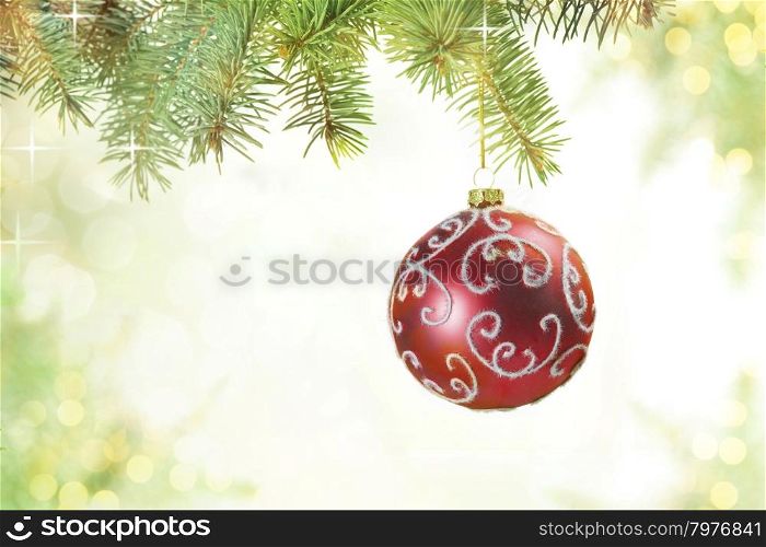 Red Balls on the Christmas Tree at the Defocused Lights Background