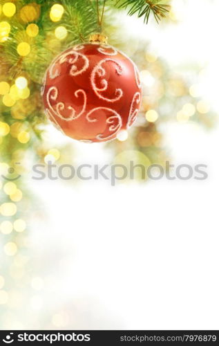 Red Balls on the Christmas Tree at the Defocused Lights Background