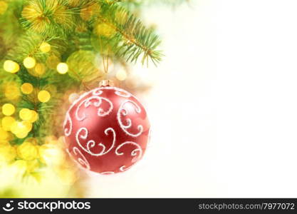 Red Balls on the Christmas Tree at the Defocused Lights Background