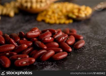 Red bean on a black cement floor background.Selective focus.