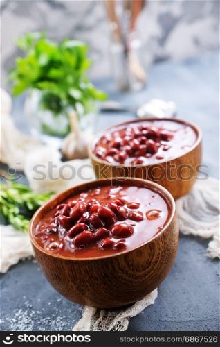 red bean with sauce in bowl and on a table