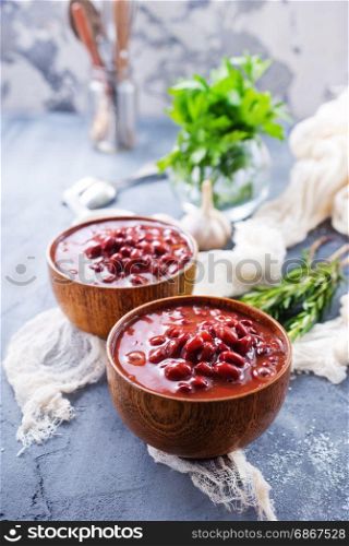 red bean with sauce in bowl and on a table