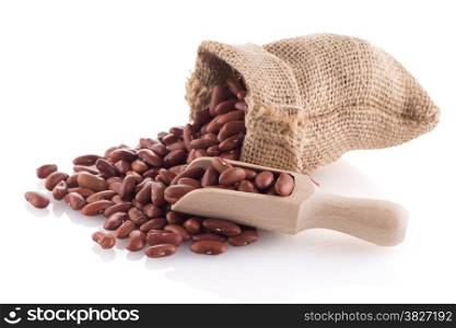 Red beans bag with wooden scoop on white background.