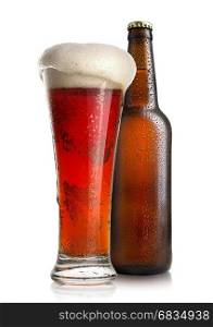 Red beer in a glass near bottle isolated on a white background