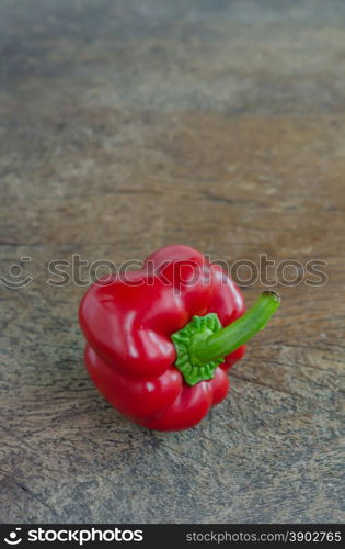 red bell pepper. red bell peppers on wooden table