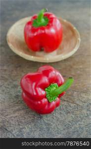 red bell pepper. red bell peppers on wooden table