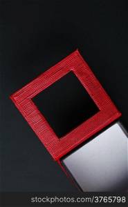 Red black rectangular ring jewellery box on dark background