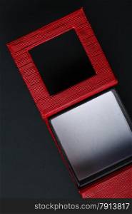 Red black rectangular ring jewellery box on dark background