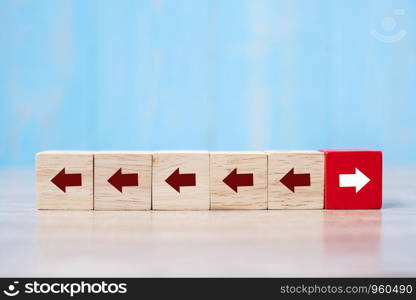 Red block with different direction of arrow on table background. Business Growth, Improvement, strategy, Successful, different and Unique Concepts