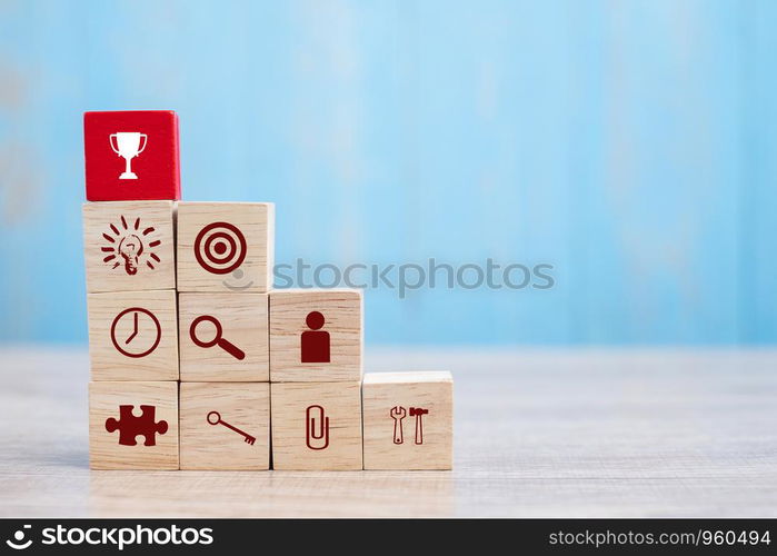 Red block with Trophy and business strategy icon on table background. Business Growth, Improvement, strategy, Successful, success, winner, cooperation and Mission complete Concepts