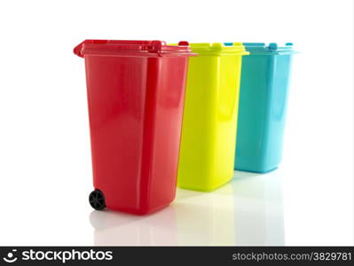 red blue and yellow green garbage bin isolated on white