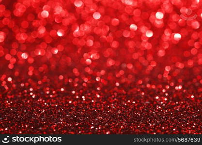 Red bokeh holiday textured glitter background