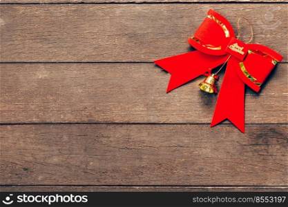 Red bow christmas on wood background with copyspace.