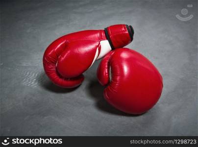 Red boxing gloves closeup. Fighting sport concept, box symbol. Red boxing gloves, closeup, nobody