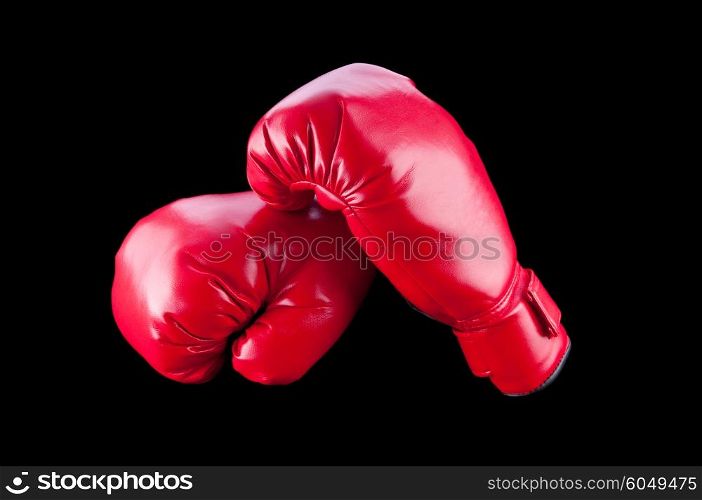 Red boxing gloves isolated on black
