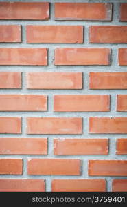 Red brick by brick walls forming the cement wall.
